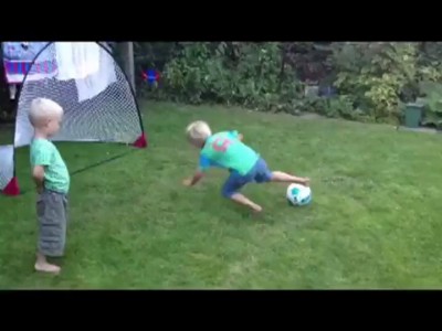 Dizzy Kid Tries Kicking Ball