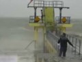 Flipping crazy: Teens filmed leaping off diving board into raging sea as Storm Desmond lashes coast