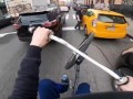 Cyclist Skillfully Weaves His Way through Traffic