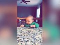 Baby gives the death stare after being sprayed with water