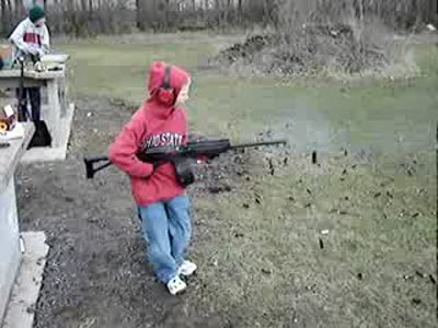 Kid can barely hold still firing a semiautomatic rifle