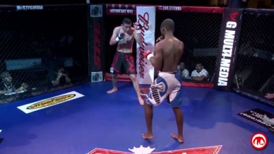 Watch this guy get head kicked so hard that he actually spins around