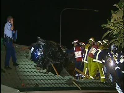 Car embedded in roof in Sydney
