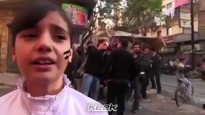 Bomb falls next to a Syrian child while chanting +18 النظا