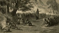 Indian chief in council informing his