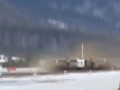 Ан-24 взлетает с раскисшей полосы.